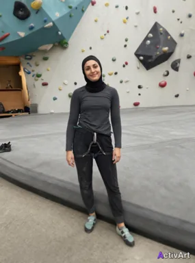 Workout photo from a indoor climbing session, restyled by ActivArt in the Cinematic style with the athlete's face and pose preserved